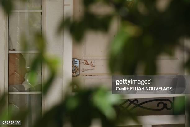 Scratches are seen by the lock on the front door of the home where ten children were allegedly tortured and abused on May 17 in Fairfield,...