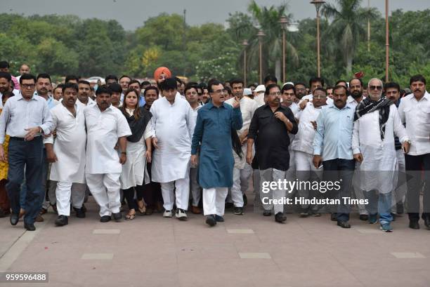 Ajay Maken, President of DPCC, along with other members of DPCC arrives to pay homage to Mahatma Gandhi in protest against BJP over the issue of...