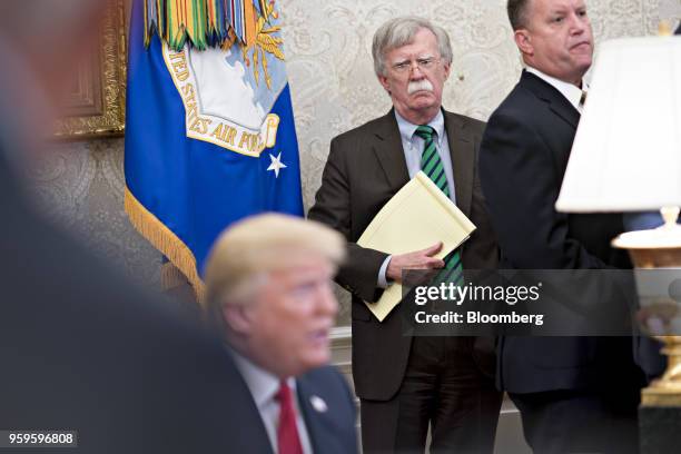 John Bolton, national security advisor, center, listens as U.S. President Donald Trump, left, speaks during a meeting with Jens Stoltenberg,...