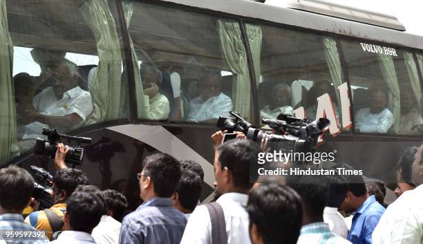 Newly elected members of Legislative Assembly of Congress return back to the Eagleton Golf Resort after a joint protest of Congress and Janata Dal at...