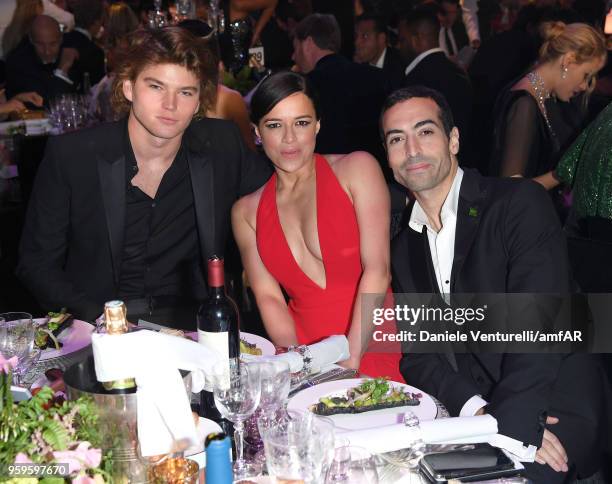 Jordan Barrett, Michelle Rodriguez and Mohammed Al Turki attend the amfAR Gala Cannes 2018 dinner at Hotel du Cap-Eden-Roc on May 17, 2018 in Cap...