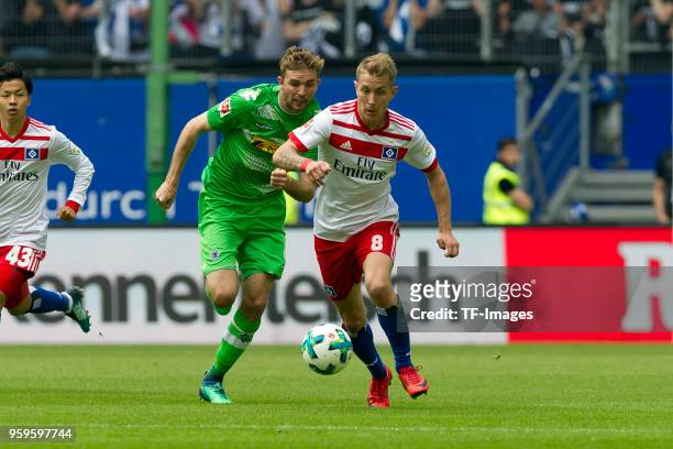 Christoph Kramer of Moenchengladbach and Lewis Holtby of Hamburg battle for the ball during the Bundesliga match between Hamburger SV and Borussia...