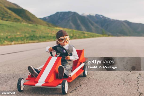 young business boy racing a go cart - driving humor stock pictures, royalty-free photos & images