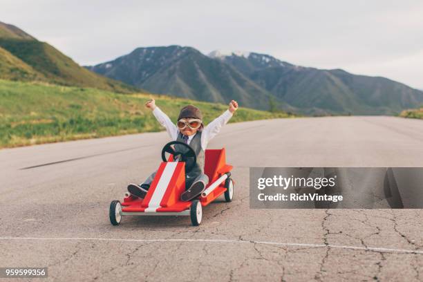 young business boy vince go cart race - solution foto e immagini stock