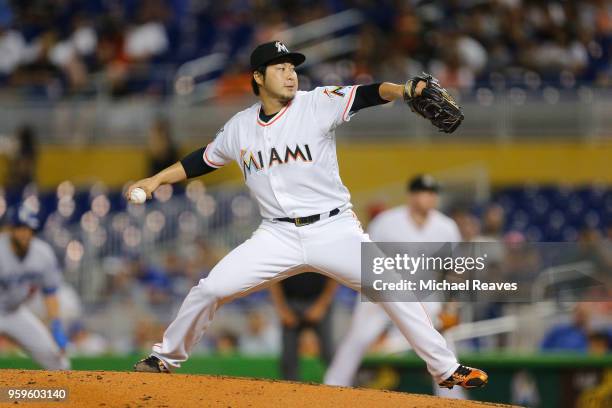 Junichi Tazawa of the Miami Marlins delivers a pitch in the fourth inning against the Los Angeles Dodgers at Marlins Park on May 17, 2018 in Miami,...