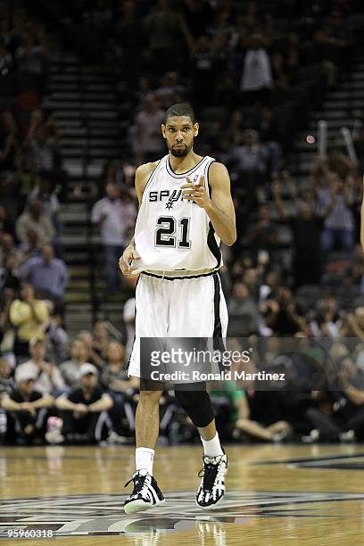 Forward Tim Duncan of the San Antonio Spurs reacts after making his 20,000 career point against the Houston Rockets at AT&T Center on January 22,...