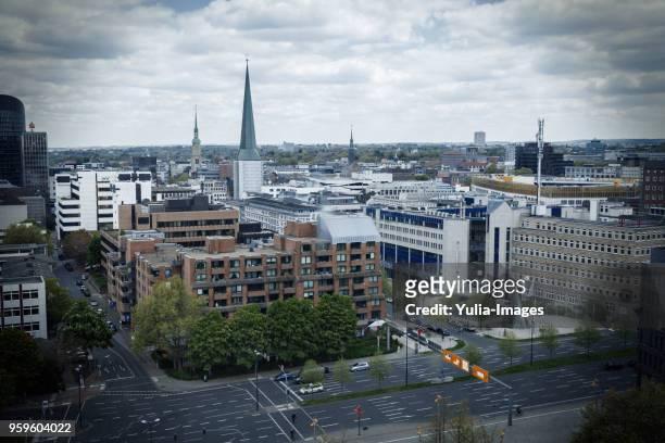 many buildings and wide streets next to each other - dortmund stad stockfoto's en -beelden