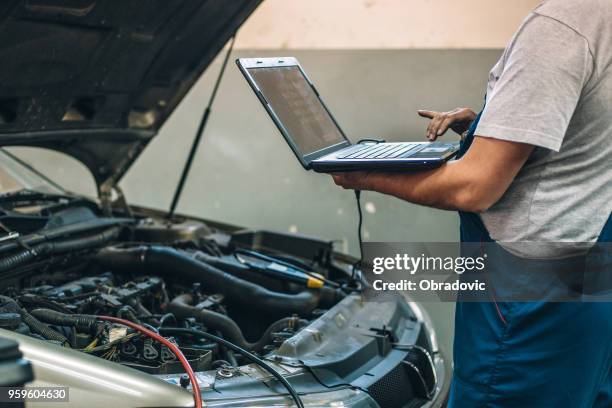 at car service - looking over laptop stock pictures, royalty-free photos & images