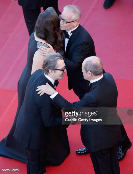 Gary Oldman and Gisele Schmidt greet Cannes Film Festival Director Thierry Fremaux and Cannes Film Festival President Pierre Lescure at the screening...