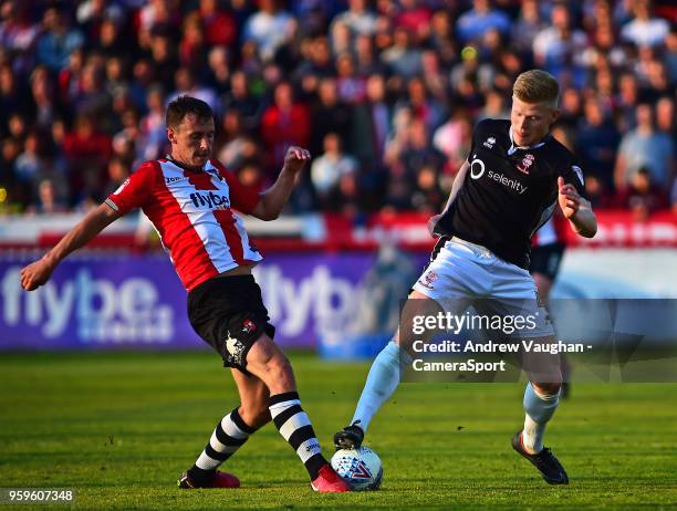 Lincoln City's Elliott Whitehouse vies for possession with Exeter City's Jordan Tillson during the Sky Bet League Two Play Off Semi Final:Second Leg...