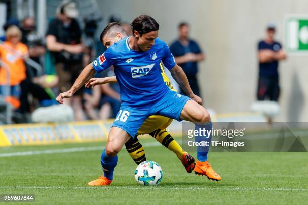 Nico Schulz of Hoffenheim and Christian Pulisic of Dortmund battle for the ball during the Bundesliga match between TSG 1899 Hoffenheim and Borussia...