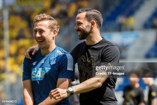 Felix Passlack of Hoffenheim speaks with Gonzalo Castro of Dortmund prior to the Bundesliga match between TSG 1899 Hoffenheim and Borussia Dortmund...