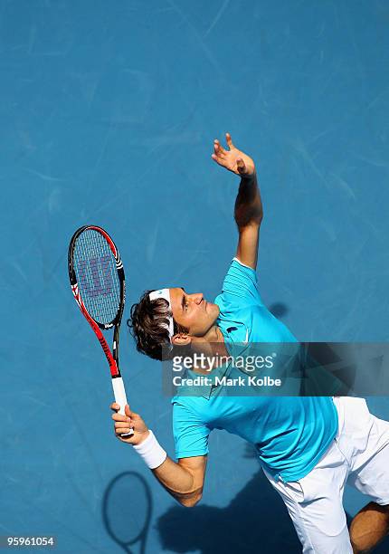 Roger Federer of Switzerland serves in his third round match against Albert Montanes of Spain during day six of the 2010 Australian Open at Melbourne...