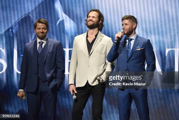 Misha Collins, Jared Padalecki and Jensen Ackles of "Supernatural" speak on stage during The CW Network's 2018 upfront at New York City Center on May...