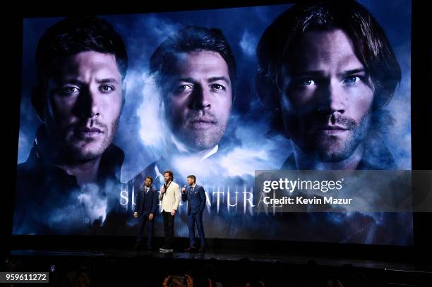 Misha Collins, Jared Padalecki and Jensen Ackles of "Supernatural" speak on stage during The CW Network's 2018 upfront at New York City Center on May...