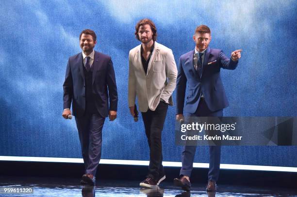 Misha Collins, Jared Padalecki and Jensen Ackles of "Supernatural" speak on stage during The CW Network's 2018 upfront at New York City Center on May...