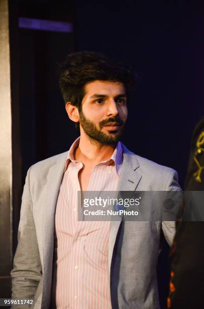Bollywood movie star Kartik Aaryan poses for photographers after a press conference by Wizcraft to announce the 19th Edition of IIFA Weekend &amp;...