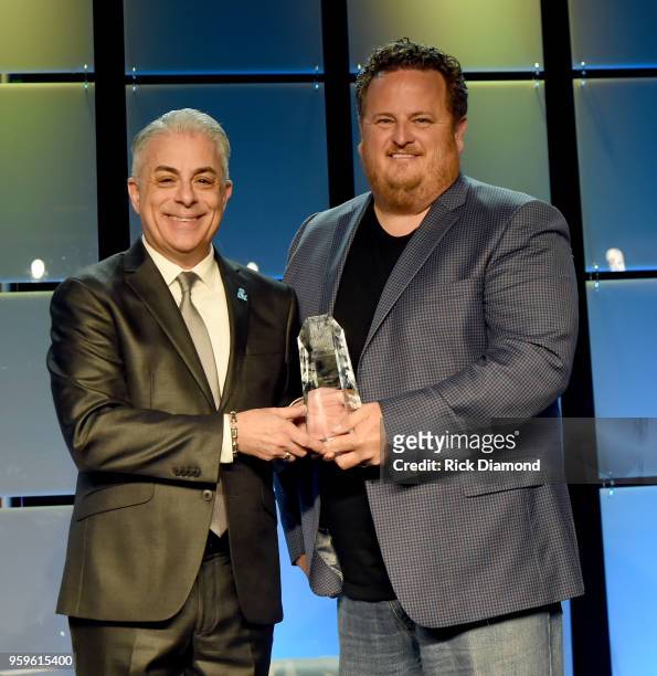 President of Music Business Association, James Donio presents an award to Scott Wagner of Atlantic Records onstage during the Music Biz 2018 Awards...