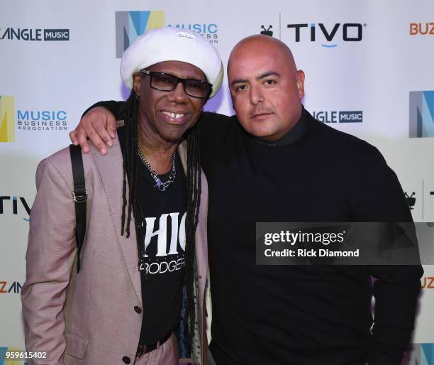 Producer Nile Rodgers and Armando Rodriguez, Senior VP of Universal Music Latin Entertainment take photos before the Music Biz 2018 Awards Luncheon...