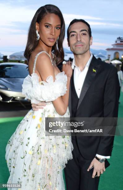 Cindy Bruna and Mohammed Al Turki attend the amfAR Gala Cannes 2018 dinner at Hotel du Cap-Eden-Roc on May 17, 2018 in Cap d'Antibes, France.