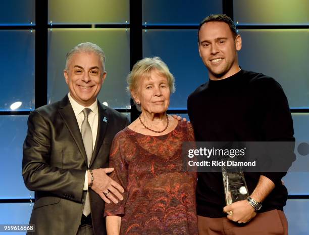 President of Music Business Association, James Donio and Sandra Chapin present an award to owner of School Boy Records and RBMG, Scooter Braun and...