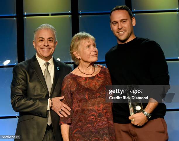 President of Music Business Association, James Donio and Sandra Chapin present an award to owner of School Boy Records and RBMG, Scooter Braun and...