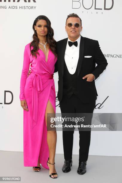 Anais Monory and Jean Roch arrive at the amfAR Gala Cannes 2018 at Hotel du Cap-Eden-Roc on May 17, 2018 in Cap d'Antibes, France.