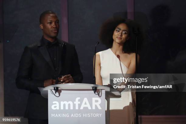 Corey Hawkins and Nathalie Emmanuel on stage at the amfAR Gala Cannes 2018 dinner at Hotel du Cap-Eden-Roc on May 17, 2018 in Cap d'Antibes, France.