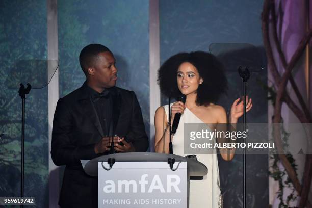Actor Corey Hawkins and British actress Nathalie Emmanuel conduct an auction on May 17, 2018 during the amfAR 25th Annual Cinema Against AIDS gala at...