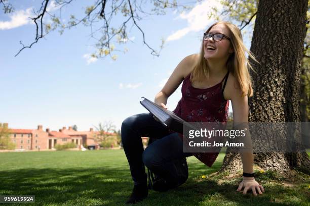 Emily Murray 19, studying on Farrand Field for her last final as she finishes her first semester as a Junior at University of Colorado Boulder . May...