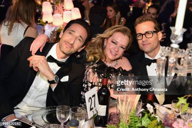 Adrien Brody, Artistic Director and Co-President of Chopard Caroline Scheufele and Gabriel Macht attend the amfAR Gala Cannes 2018 dinner at Hotel du...