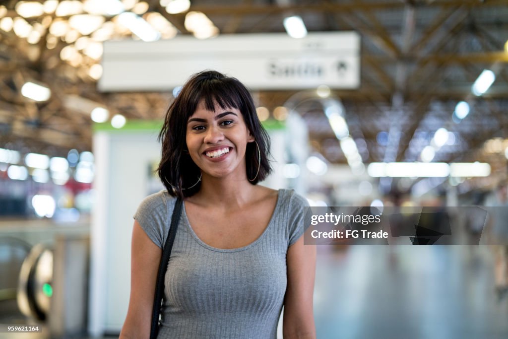 Portrait of Young Woman at Subway Station