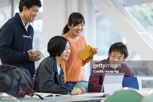 group of students studying together - only japanese stock pictures, royalty-free photos & images