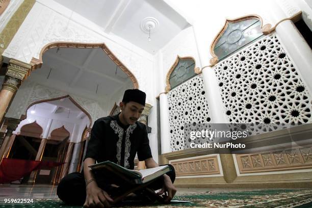 The Acehnese were reading the Qur'an at night during the month of Ramadan at the Syuhada Mosque in Lhokseumawe, Aceh, Indonesia, on May 18, 2018....