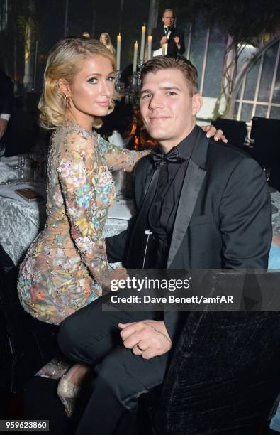 Paris Hilton and Chris Zylka attend the amfAR Gala Cannes 2018 dinner at Hotel du Cap-Eden-Roc on May 17, 2018 in Cap d'Antibes, France.