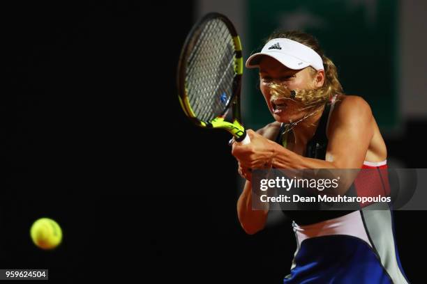 Caroline Wozniacki of Denmark returns a backhand in her match against Anastasija Sevastova of Latvia during day 5 of the Internazionali BNL d'Italia...