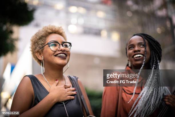 two students walking in university - student portrait stock pictures, royalty-free photos & images
