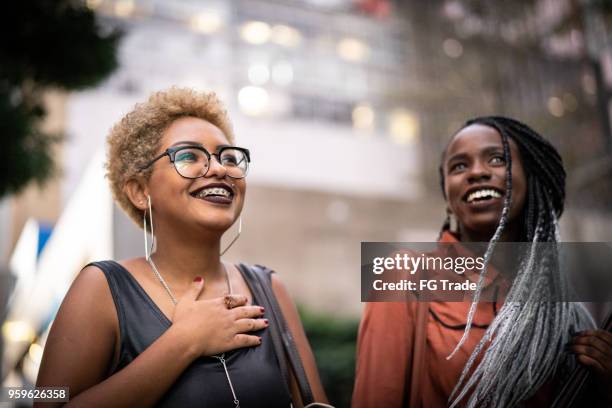 two students walking in university - student lifestyles stock pictures, royalty-free photos & images