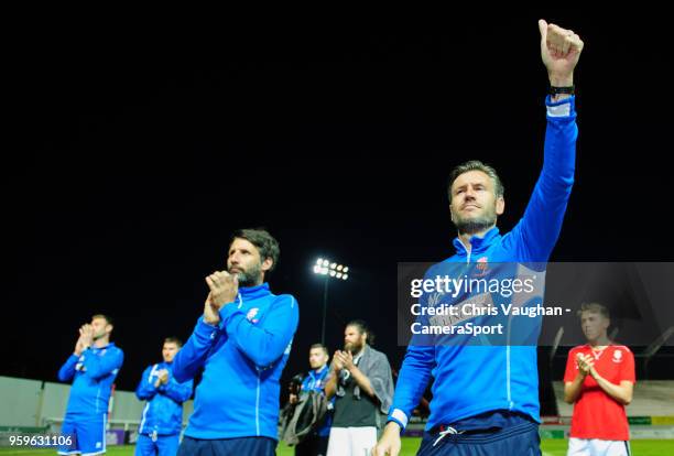 Lincoln City manager Danny Cowley, left, and Lincoln City's assistant manager Nicky Cowley applaud the fans at the end of the Sky Bet League Two Play...