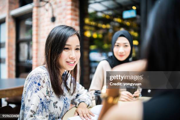 multi-ethnic girls having a meeting - yongyuan stock pictures, royalty-free photos & images