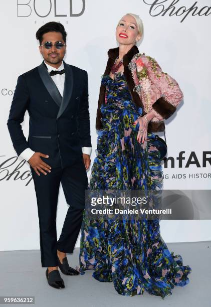 Samuel Sohebi and Brigette Diller arrive at the amfAR Gala Cannes 2018 at Hotel du Cap-Eden-Roc on May 17, 2018 in Cap d'Antibes, France.