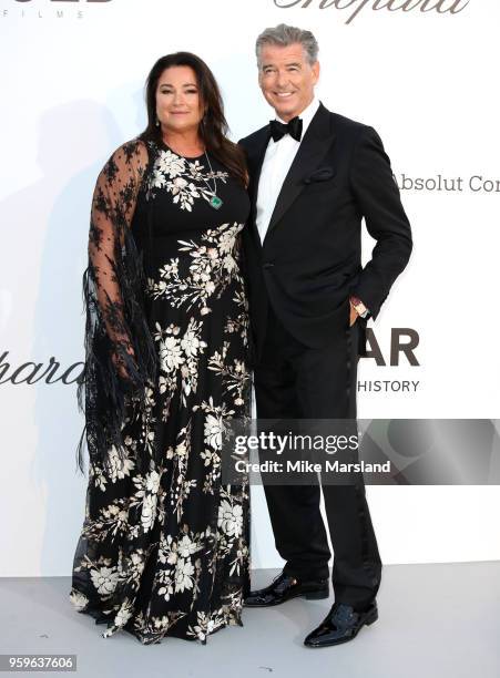 Keely Shaye Smith and Pierce Brosnan arrive at the amfAR Gala Cannes 2018 at Hotel du Cap-Eden-Roc on May 17, 2018 in Cap d'Antibes, France.