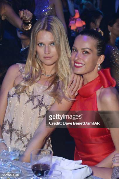 Toni Garrn and Petra Nemcova attend the amfAR Gala Cannes 2018 dinner at Hotel du Cap-Eden-Roc on May 17, 2018 in Cap d'Antibes, France.