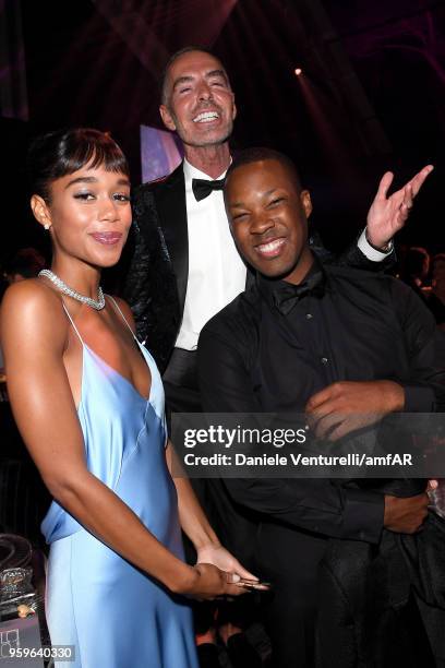 Corey Hawkins, Dan Caten and Laura Harrier attend the amfAR Gala Cannes 2018 dinner at Hotel du Cap-Eden-Roc on May 17, 2018 in Cap d'Antibes, France.