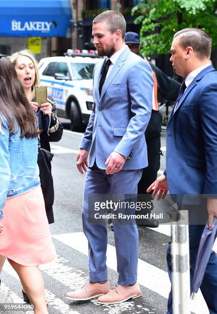 Stephen Amell is seen walking in midtown on May 17, 2018 in New York City.
