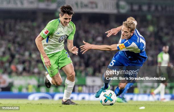 Josip Brekalo of VfL Wolfsburg in action with Johannes van den Bergh of Holstein Kiel during the Bundesliga Playoff Leg 1 match between VfL Wolfsburg...