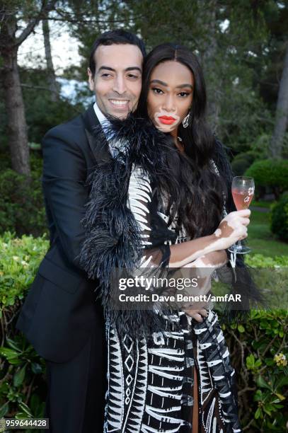 Mohammed Al Turki and Winnie Harlow attend the amfAR Gala Cannes 2018 dinner at Hotel du Cap-Eden-Roc on May 17, 2018 in Cap d'Antibes, France.