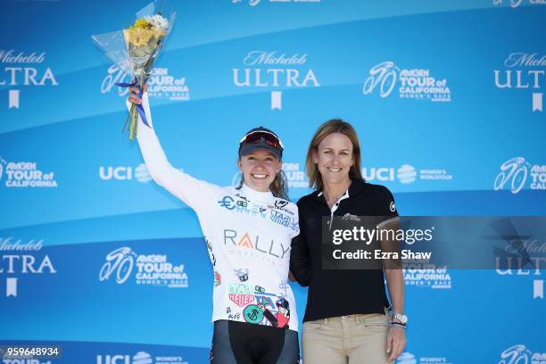 Emma White of the United States riding for Rally Cycling stands on the podium with Kristin Armstrong, 3-time Olympic gold medalist, after being...