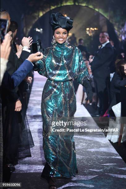 Halima Aden wearing Marc Jacobs walks the runway at the amfAR Gala Cannes 2018 at Hotel du Cap-Eden-Roc on May 17, 2018 in Cap d'Antibes, France.