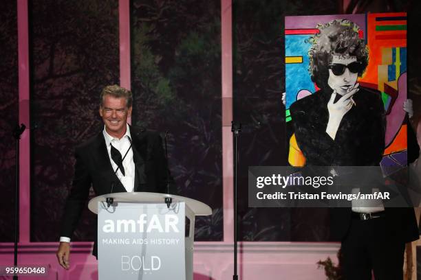 Pierce Brosnan on stage at the amfAR Gala Cannes 2018 at Hotel du Cap-Eden-Roc on May 17, 2018 in Cap d'Antibes, France.